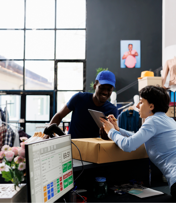 Staff processing orders at a retail counter
