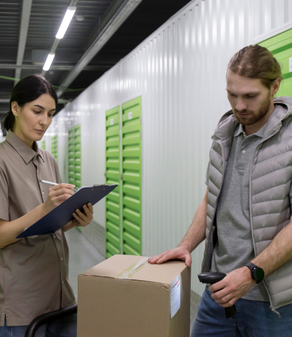 ERP expert team scanning inventory in a warehouse.